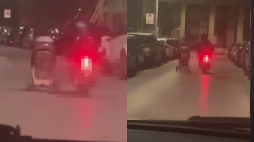 Spinge un passeggino di notte dalla sella di uno scooter: il video shock